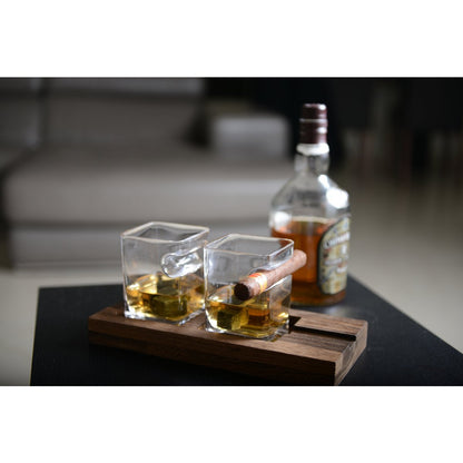 Glass whiskey set with wooden support and stone ice cubes