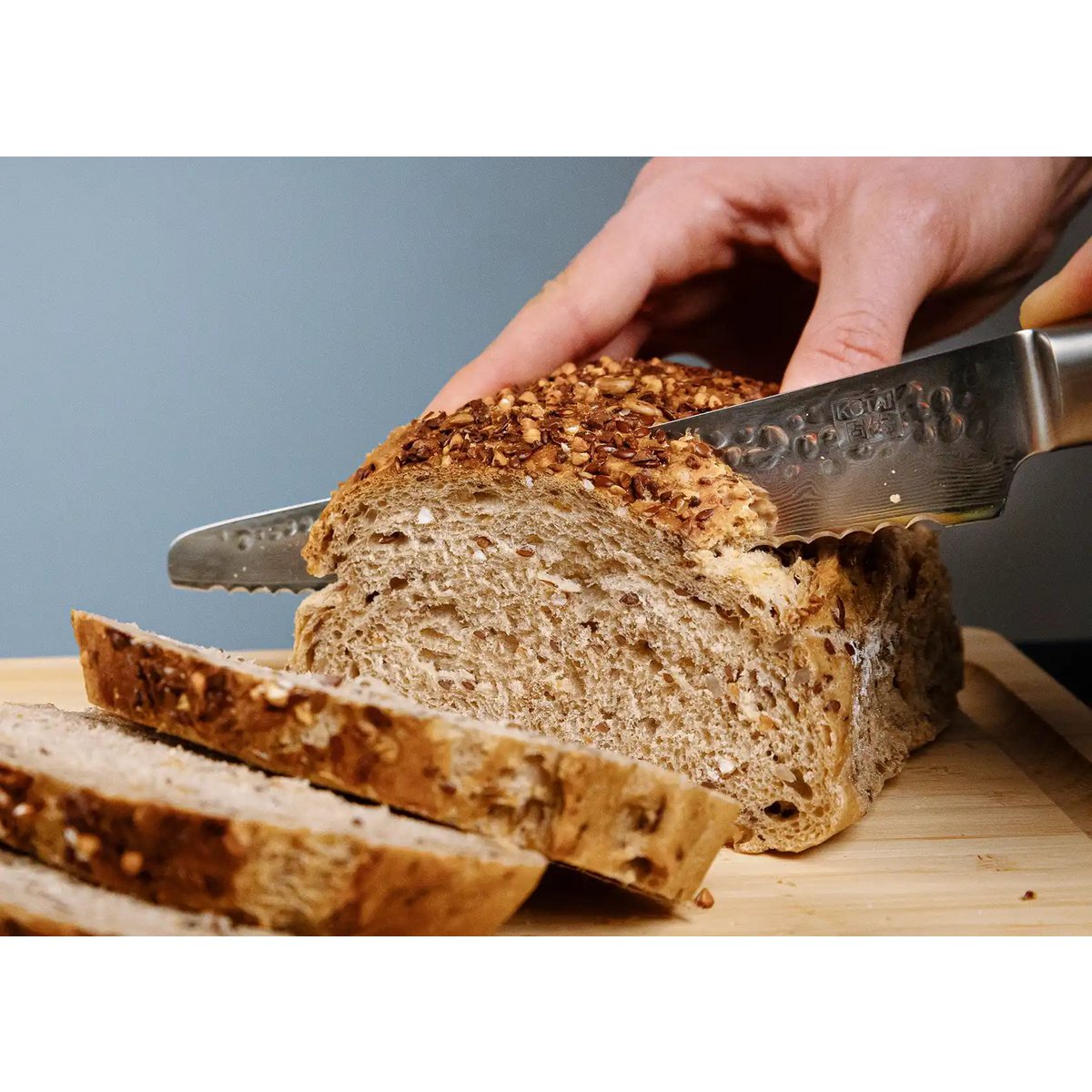 Damascus serrated bread knife 200 mm - wood handle