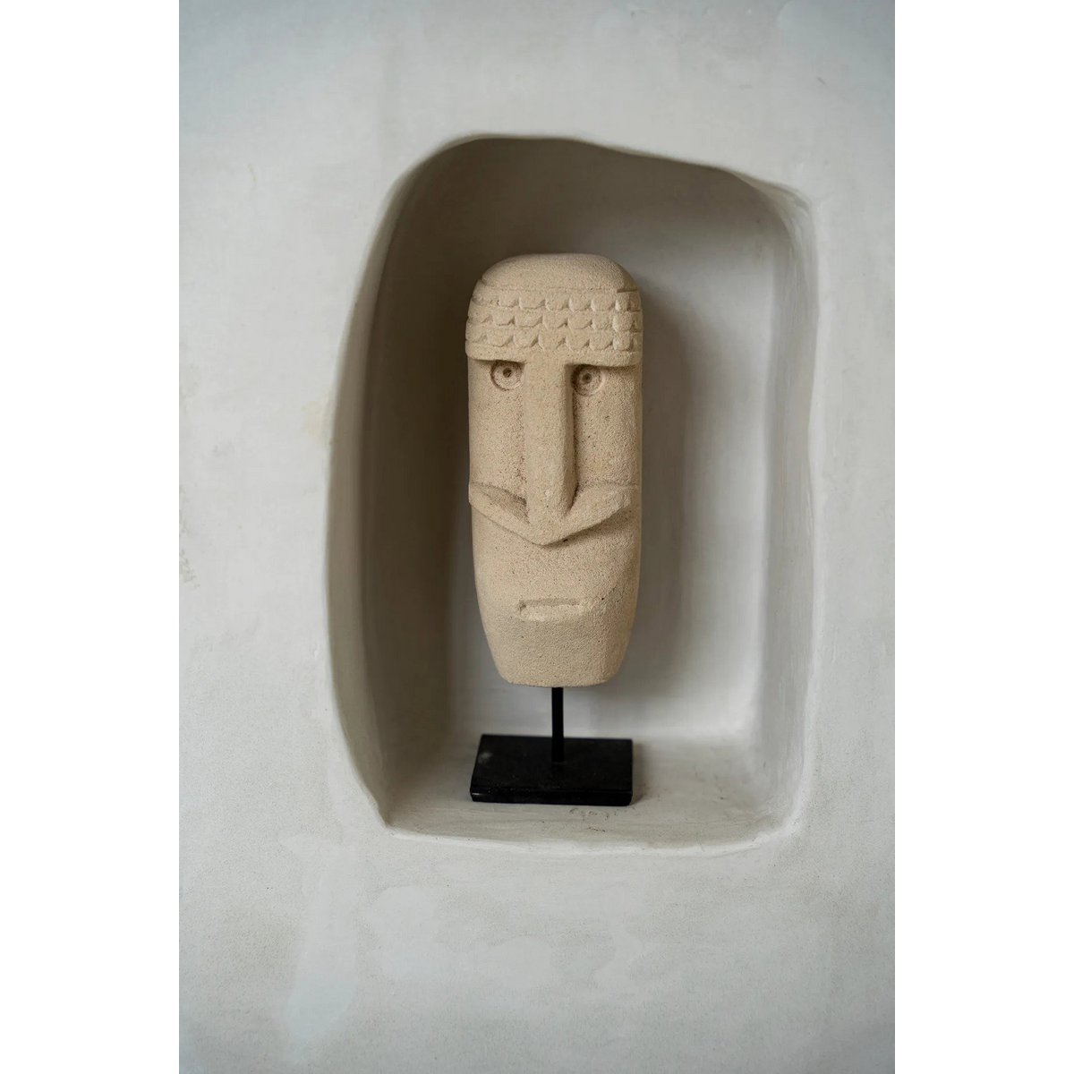 Sumba stone face on stand - hand carved